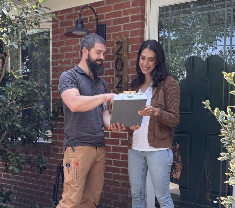 Upstate Structural Repair specialist reviewing findings with a homeowner