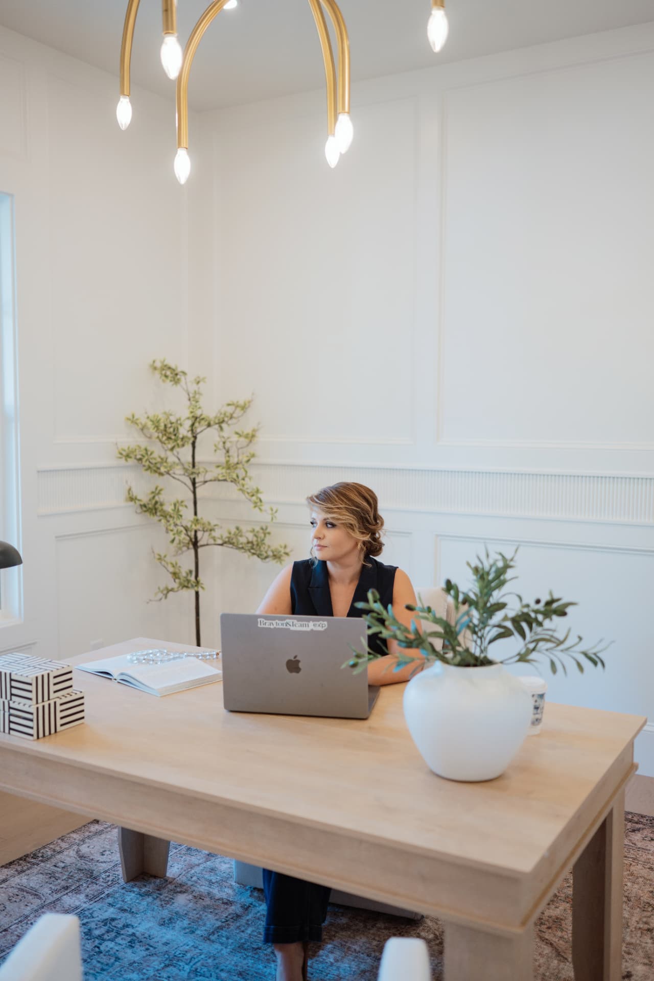 Gabby Brayton at her desk with her laptop