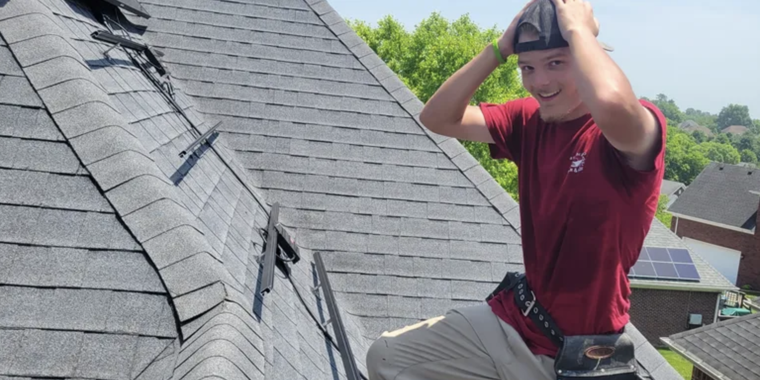 Redemption Solar and Roofing team member on a residential roof