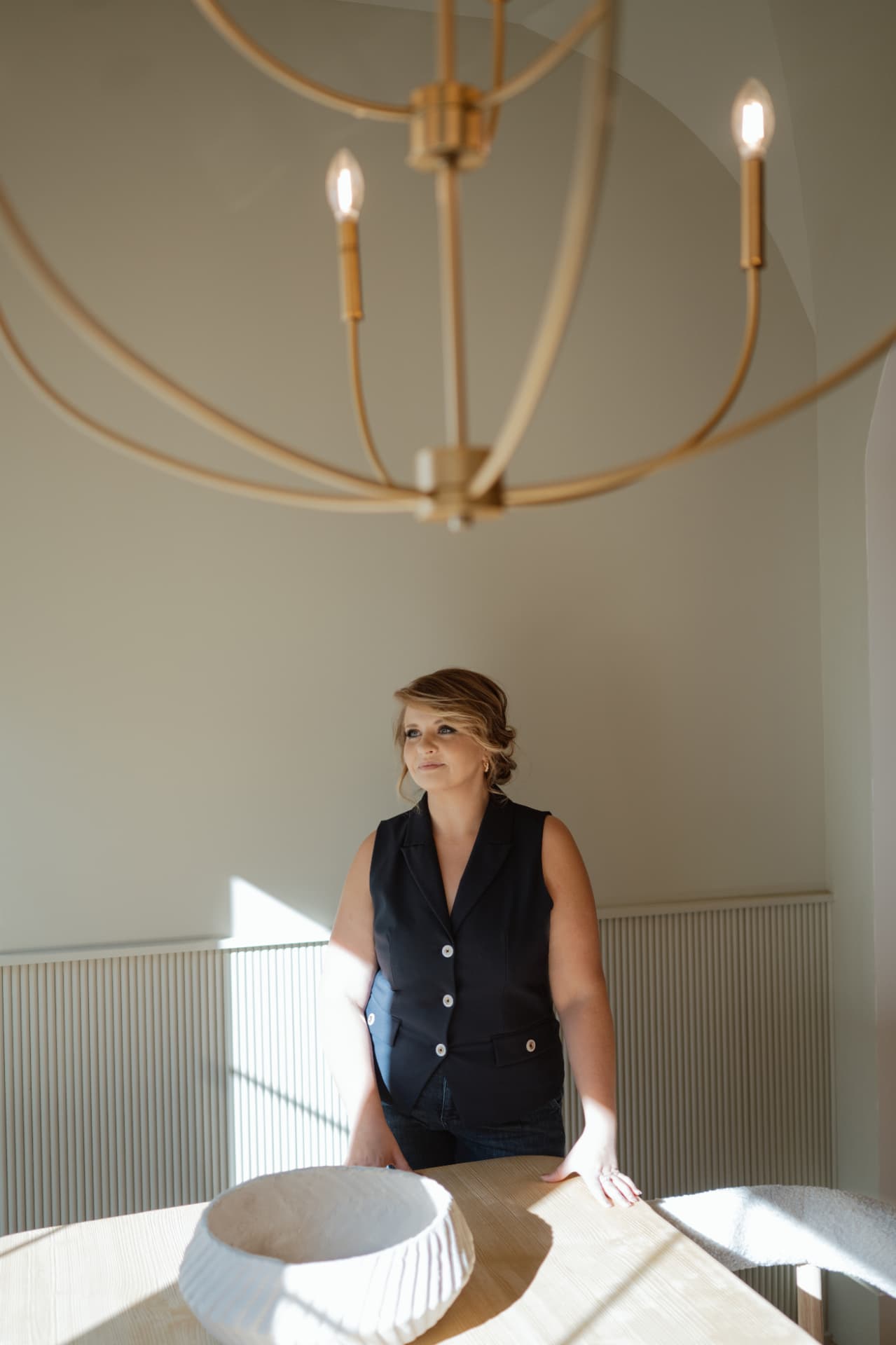 Gabby Brayton standing in a bright, modern office